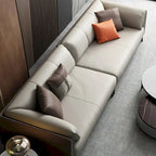 Divano con braccioli in ecopelle e imbottitura pillow top, cuscini reversibili - tre posti